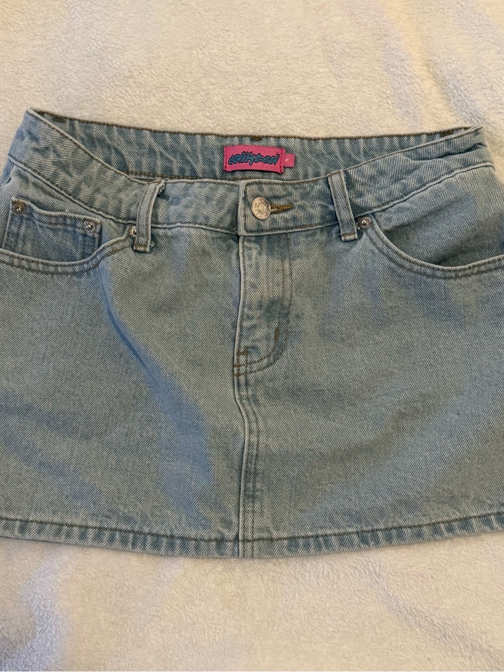 Edikted size S light-wash denim mini skirt featuring a low-rise fit